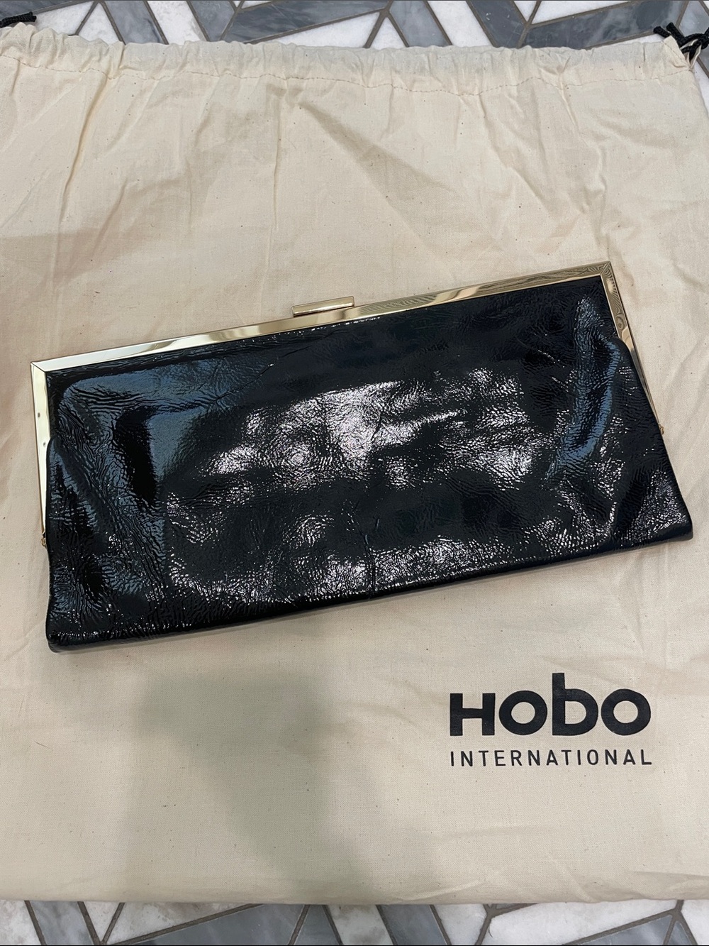HOBO Black Patent Leather Clutch with Gold Frame